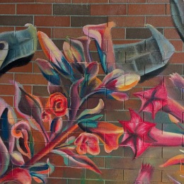 a mural on a wall of flowers